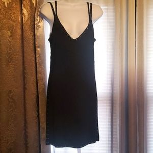 Very cute mini black sleeveless dress with gold stud detail